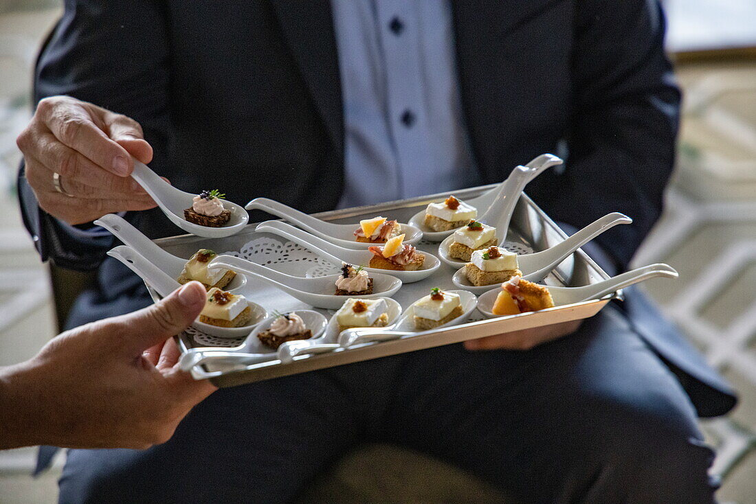 Canapés being served at the Captain's Welcome Reception in the Main Lounge aboard expedition cruise ship World Voyager (Nicko Cruises), Santa Cruz de La Palma, La Palma, Canary Islands, Spain, Europe