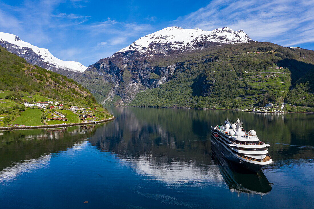 Aerial view of expedition cruise ship World Voyager (nicko cruises) at roadstead in Geirangerfjord, Geiranger, Møre og Romsdal, Norway, Europe