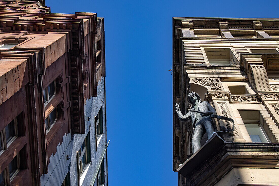 John Lennon statue on the ledge of the Hard Days Night Hotel on Mathew Street, Liverpool, England, United Kingdom, Europe