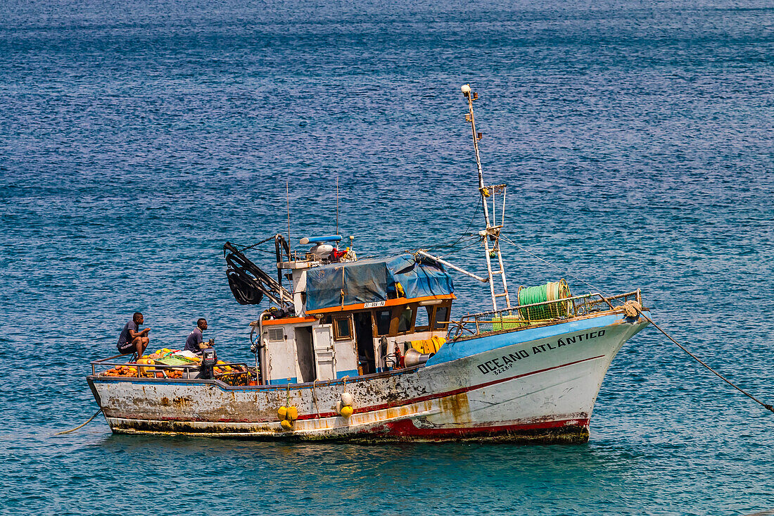 Two fishermen in a boat off the coast of Tarrafal in the north of Santiago Island, Cape Verde, Macaronesia