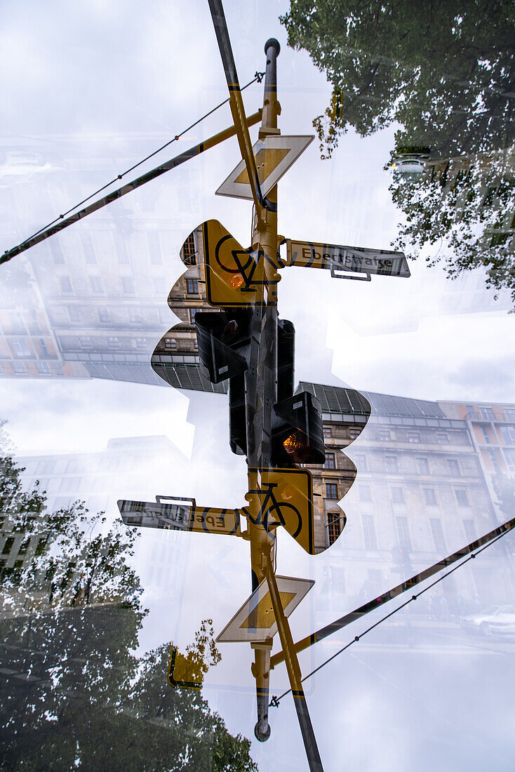 Double exposure of a streetlight and signs in Berlin, Germany.