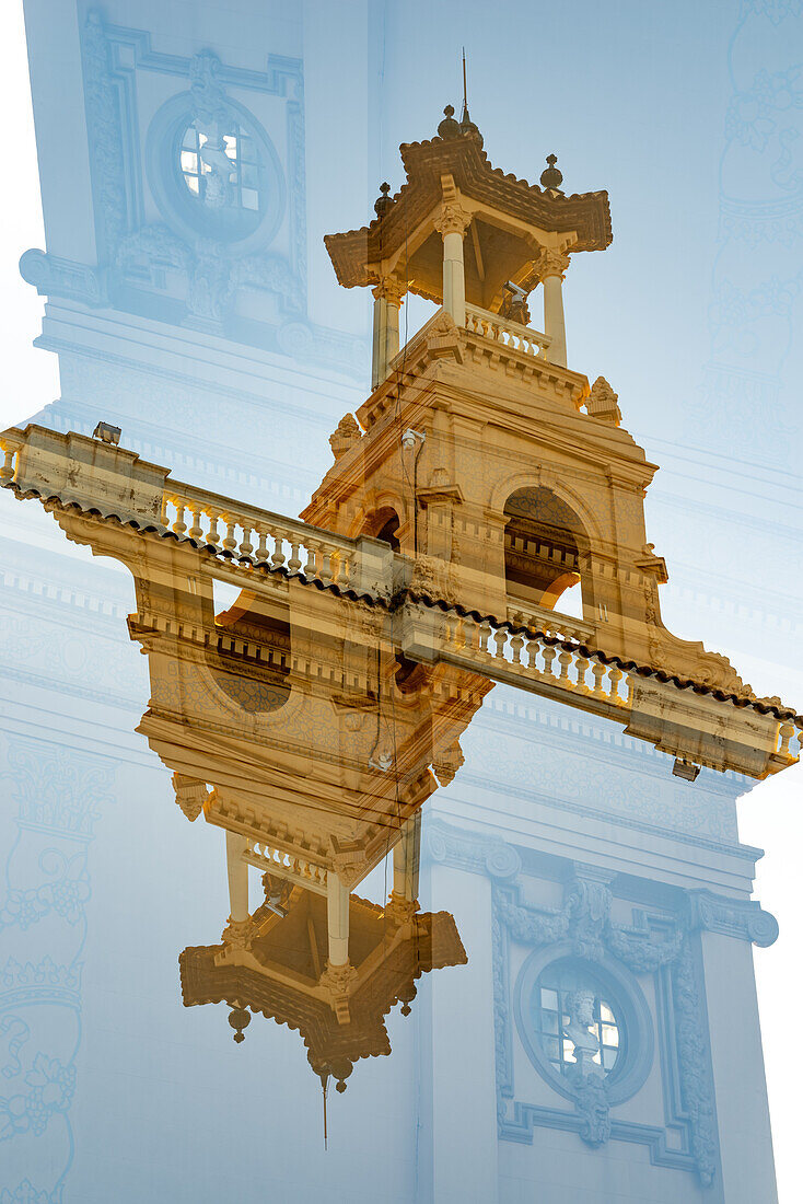 Double exposure photograph of the Palau Victoria Eugenia seen from the Plaça de Josep Puig i Cadafalch near the Font Majica in Barcelona