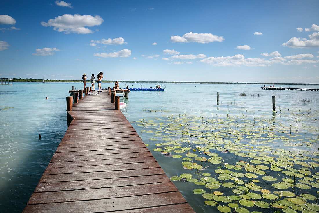 Jetty with bathers in the Bacalar Lagoon, Quintana Roo, Yucatán, Mexico, North America, Latin America