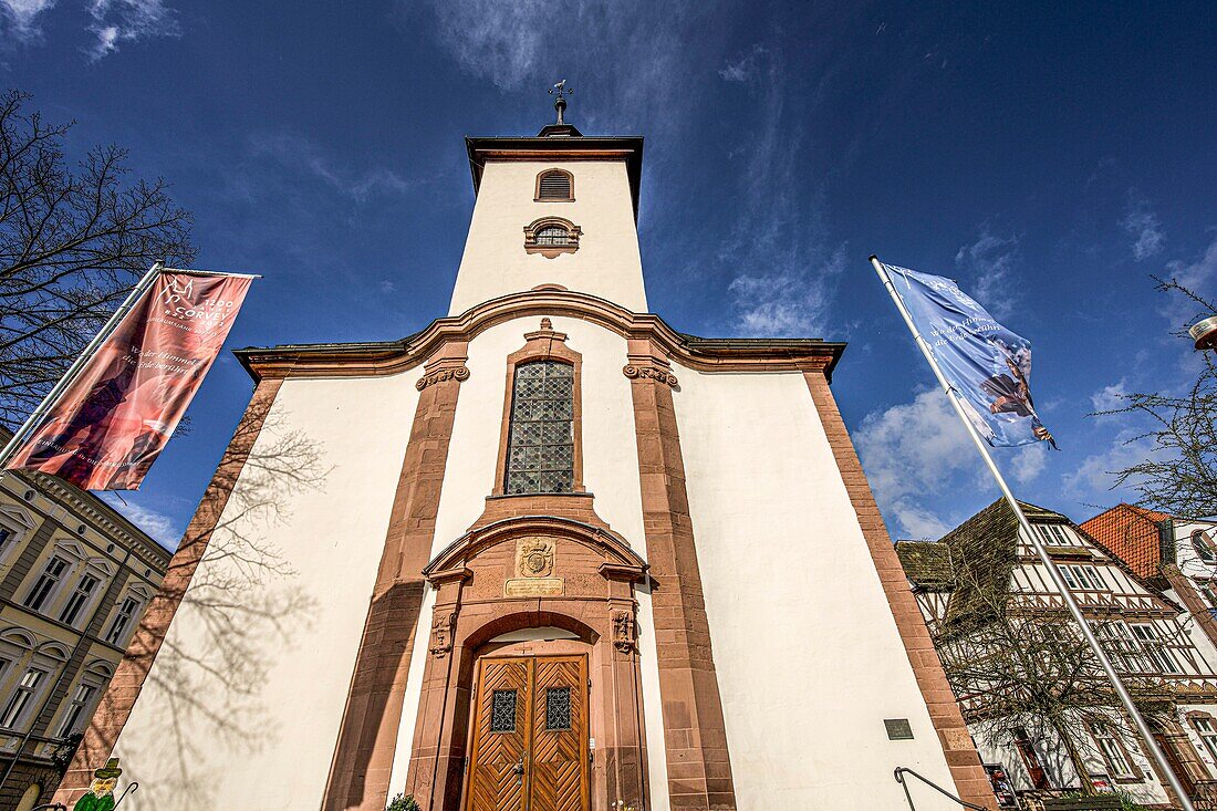Niikolai Church in the evening light with flags for the 1200th anniversary of Corvey, old town of Höxter, Weserbergland, North Rhine-Westphalia, Germany