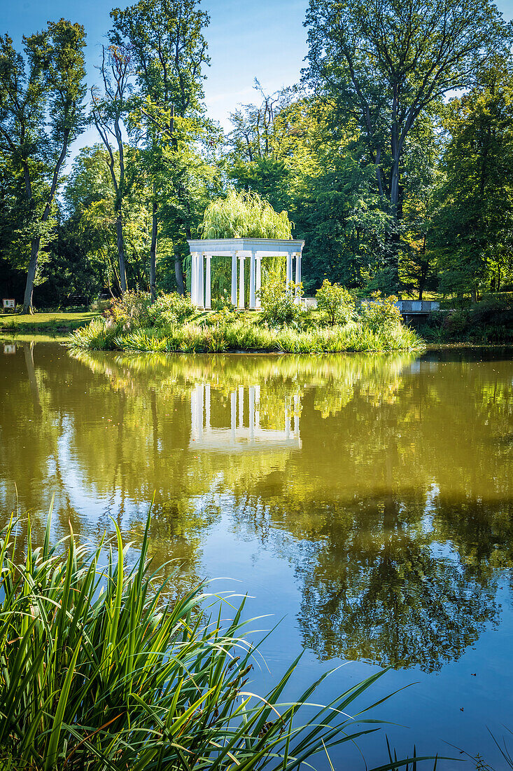 Pond with island and colonnades in Kleiner Tannenwald park in Bad Homburg vor der Hoehe, Taunus, Hesse, Germany