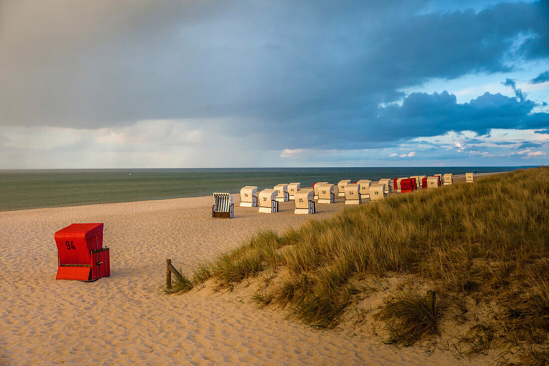 Beach chairs with storm clouds in Prerow, Mecklenburg-West Pomerania, Northern Germany, Germany