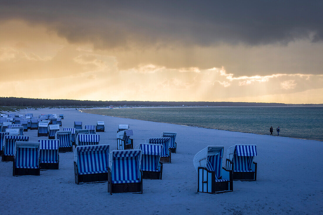 Beach chairs with storm clouds in Prerow, Mecklenburg-West Pomerania, Northern Germany, Germany