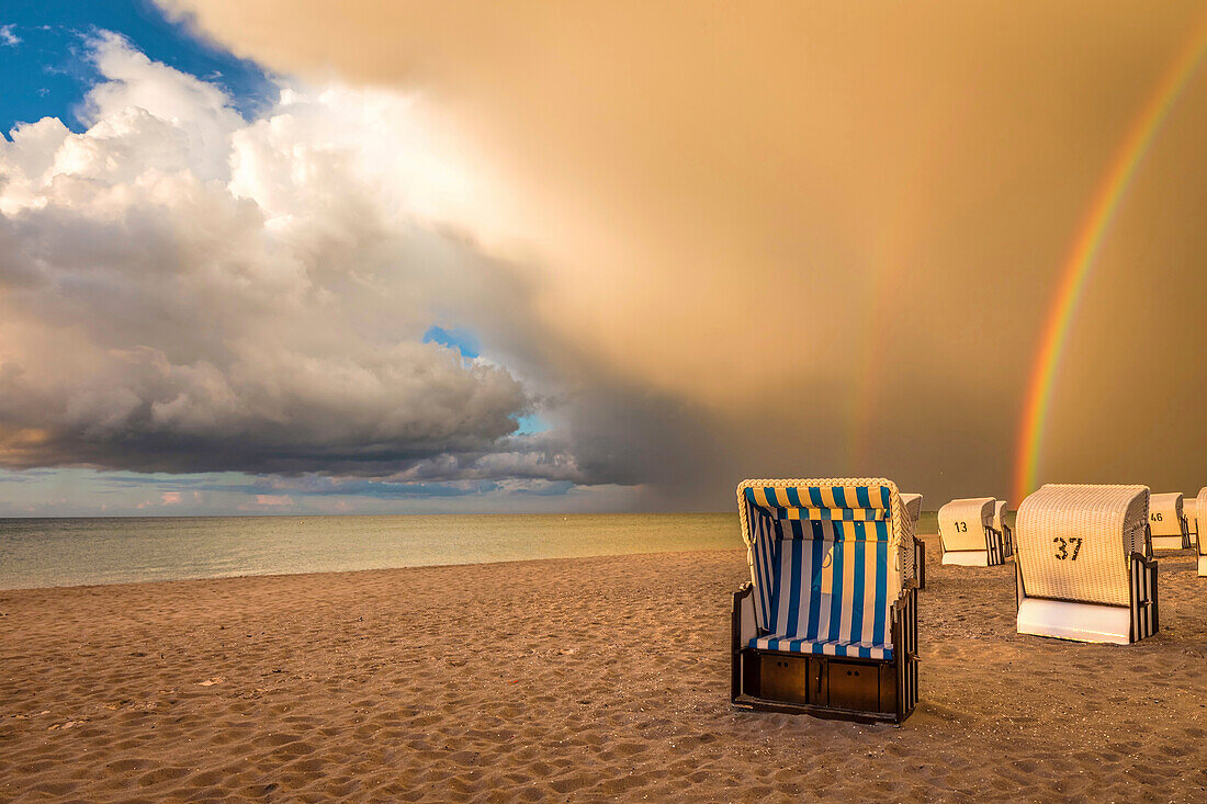 Beach chairs with storm clouds in Prerow, Mecklenburg-West Pomerania, Northern Germany, Germany