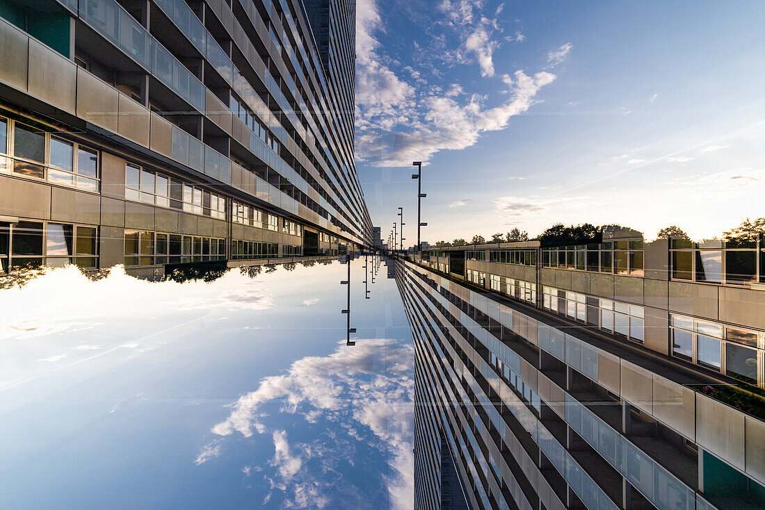 Double exposure of a modern housing complex on the left bank of the river Donau in Viennna, Austria, as seen from the Leonard Bernstein Street.