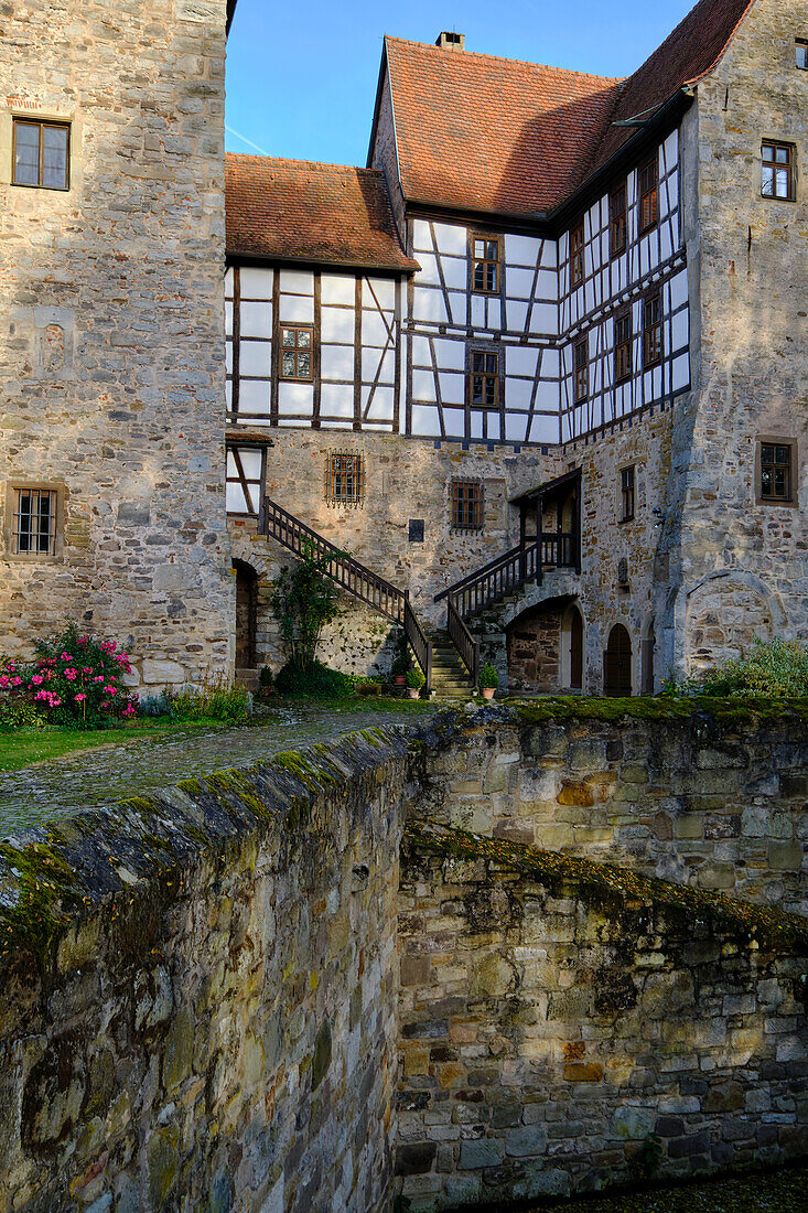 Moated castle Brennhausen near the Reutsee near Sulzdorf at the Lederhecke, Rhön-Grabfeld district, Lower Franconia, Bavaria, Germany