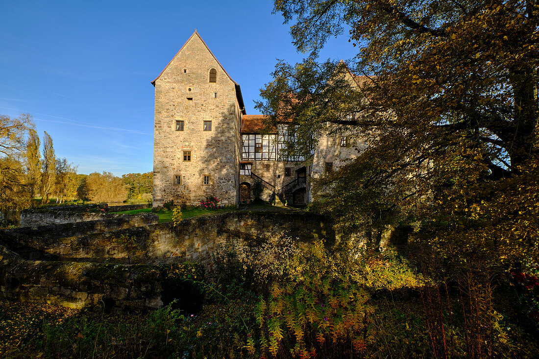 Moated castle Brennhausen near the Reutsee near Sulzdorf at the Lederhecke, Rhön-Grabfeld district, Lower Franconia, Bavaria, Germany