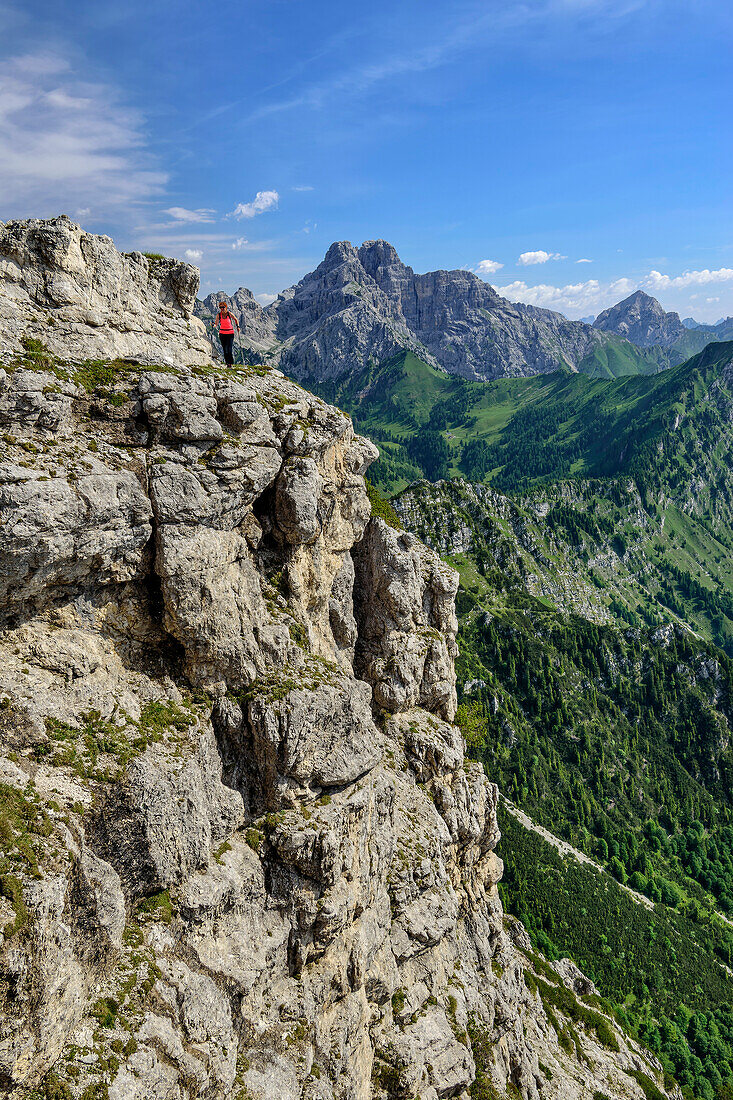 Woman hiking on the ridge path, Feltriner Berge, Belluneser Höhenweg, Dolomites, Veneto, Venetia, Italy