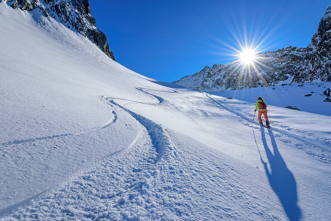 Woman on ski tour ascending to Hauserspitze, Hauserspitze, Tuxertal, Zillertal Alps, Tyrol, Austria