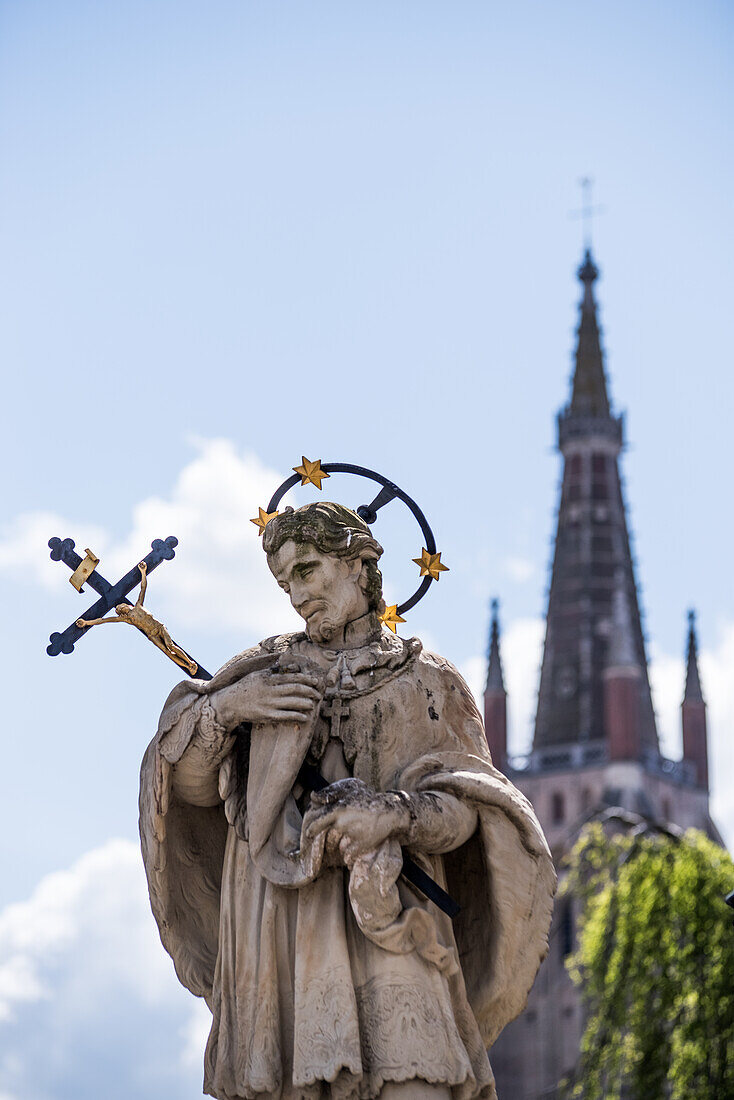 Statue of a saint posted at the beginning of the Wollestraat in Bruges, Belgium.