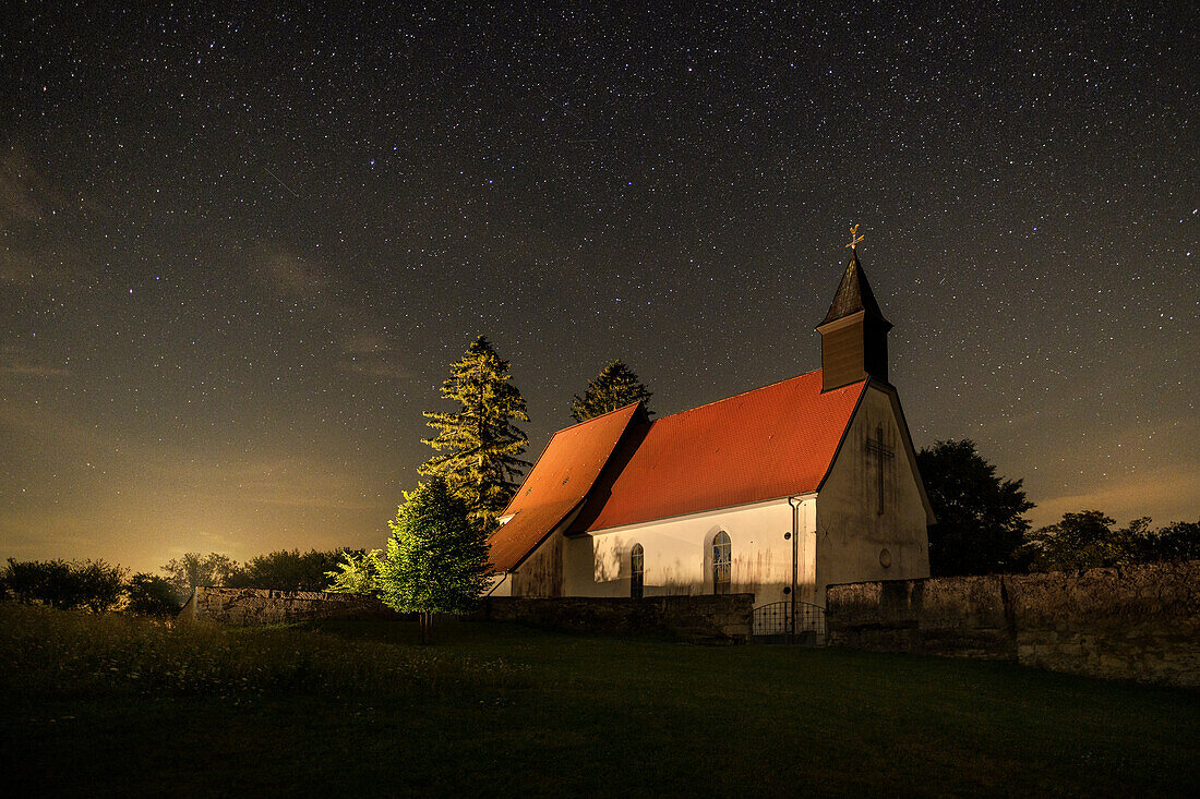 abandoned village of Gruorn with cemetery and church during the Perseids (shooting stars), military training area near Münsingen, biosphere reserve, Swabian Jura, Baden-Wuerttemberg, Germany, Europe