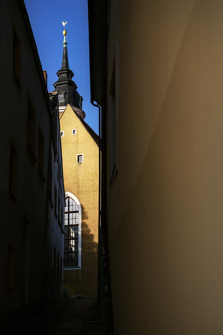 Light and shadow play in a narrow alley in the old town of Freiberg, Mittelsachsen, Ore Mountains, Saxony, Germany, Europe