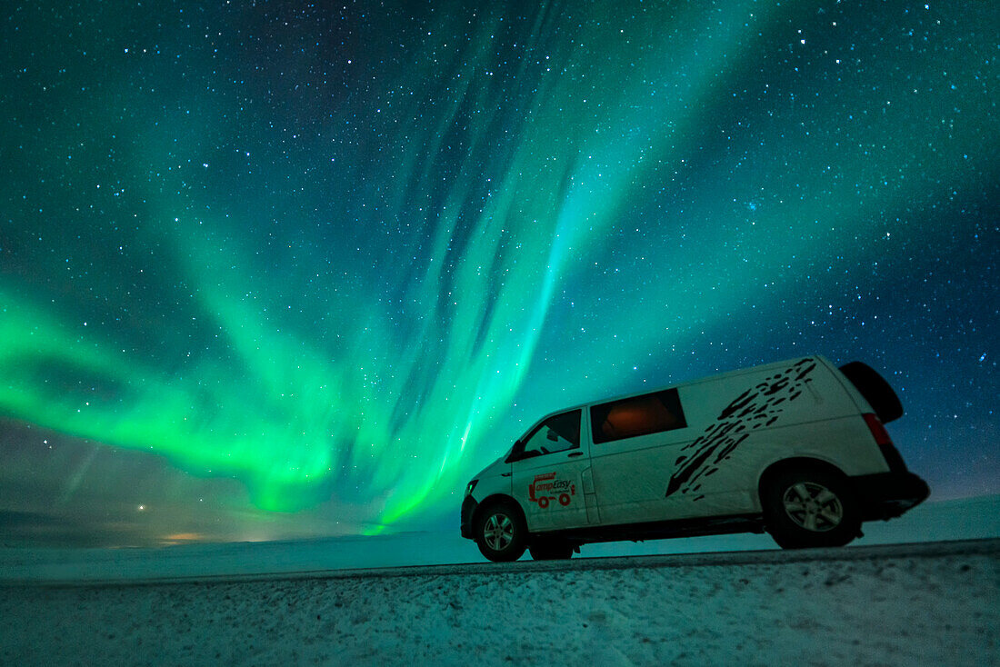 Aurora Borealis over a camper van in Iceland, Iceland.