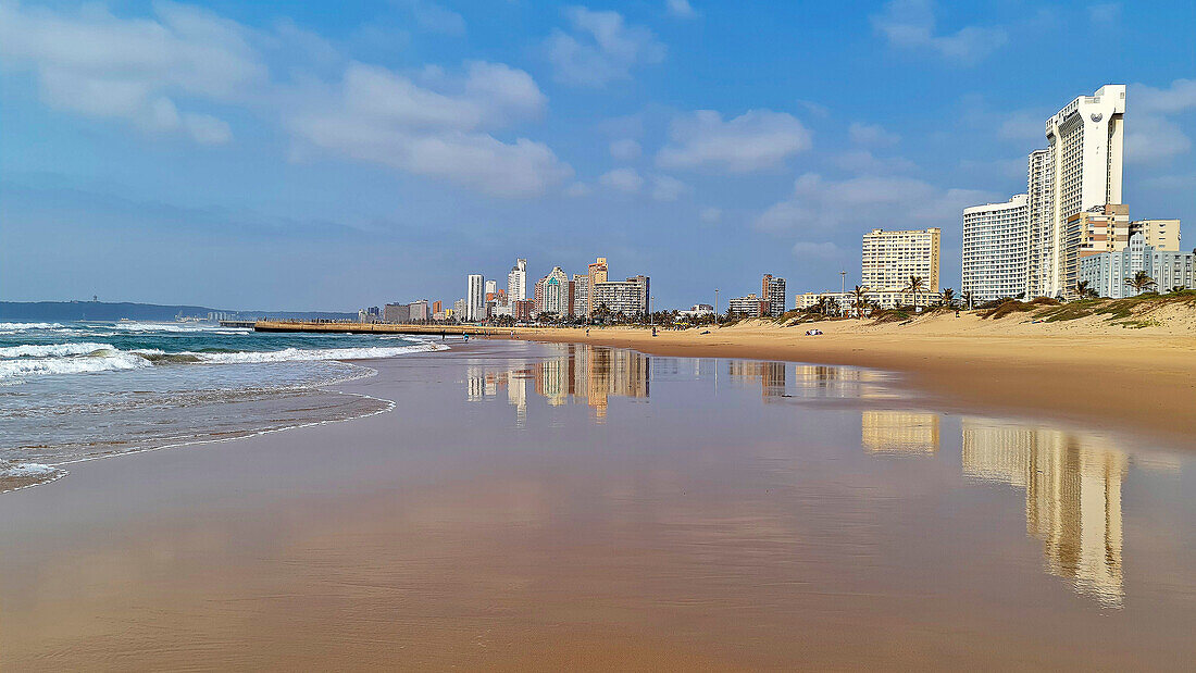 Sandy beach and silhouette of Durban, Durban, South Africa