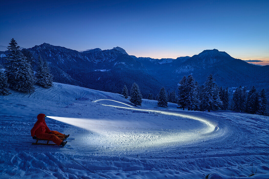 Headlamp light from sled riders at Farrenpoint, Farrenpoint, Bavarian Alps, Upper Bavaria, Bavaria, Germany