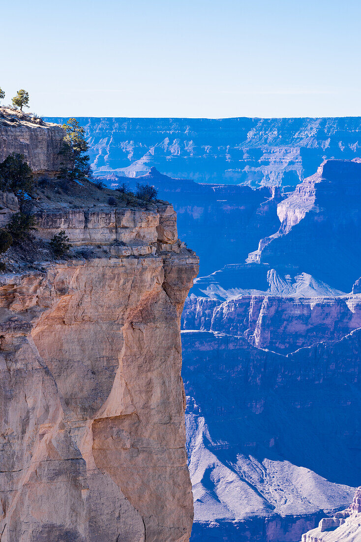 The Grand Canyon as seen from the South Rim in Arizona. The large gorge was eroded over millions of years by weather and the Colorado river that still runs through it. The reddish tint it has is due to the iron contained in the rock's minerals that oxide.