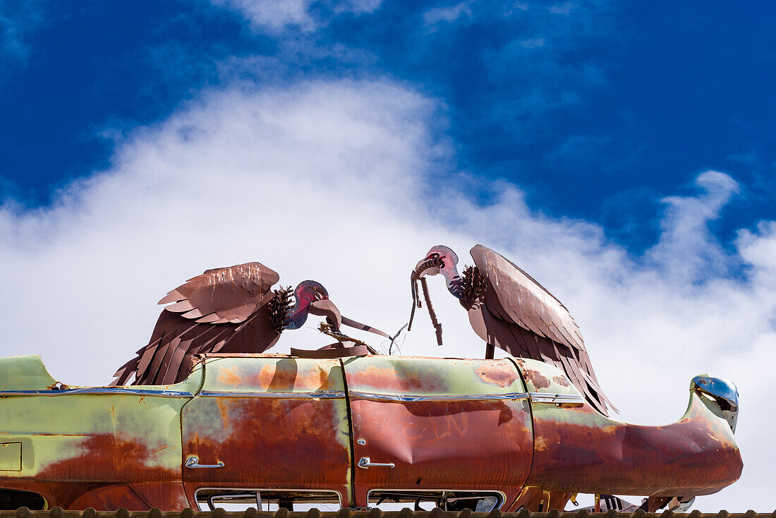 Vulture sculpture made of board metal.