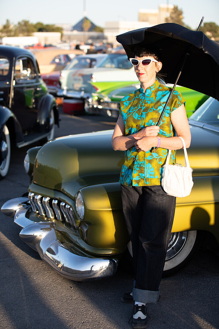 Woman with vintage outfit on a classic car show in Las Vegas