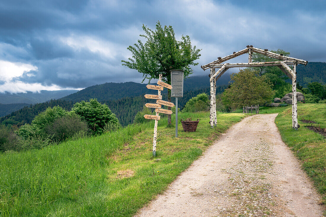 Wooden gate and signpost on the hiking trail to the Giersteinen in Bermersbach, Forbach, Black Forest, Baden-Württemberg, Germany