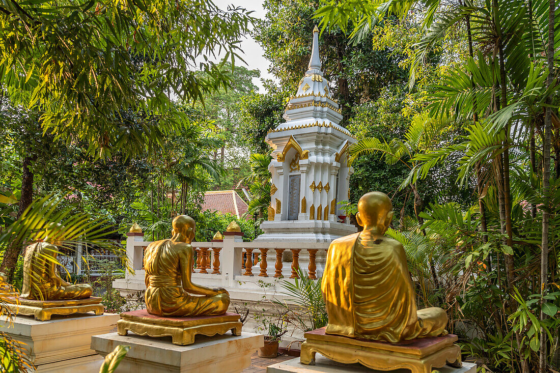 Golden statues of monks in the garden of the Buddhist temple complex Wat Phra Singh, Chiang Mai, Thailand, Asia