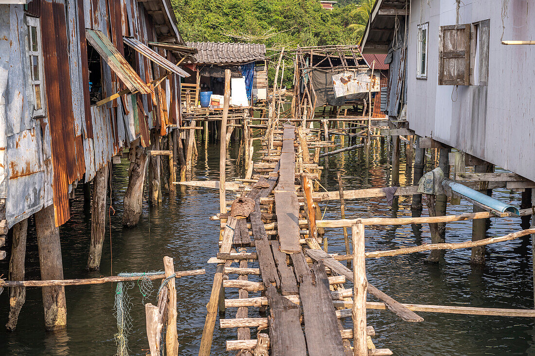 Wooden bridge in fishing village of Ban Ao Salad, island of Ko Kut or Koh Kood in the Gulf of Thailand, Asia
