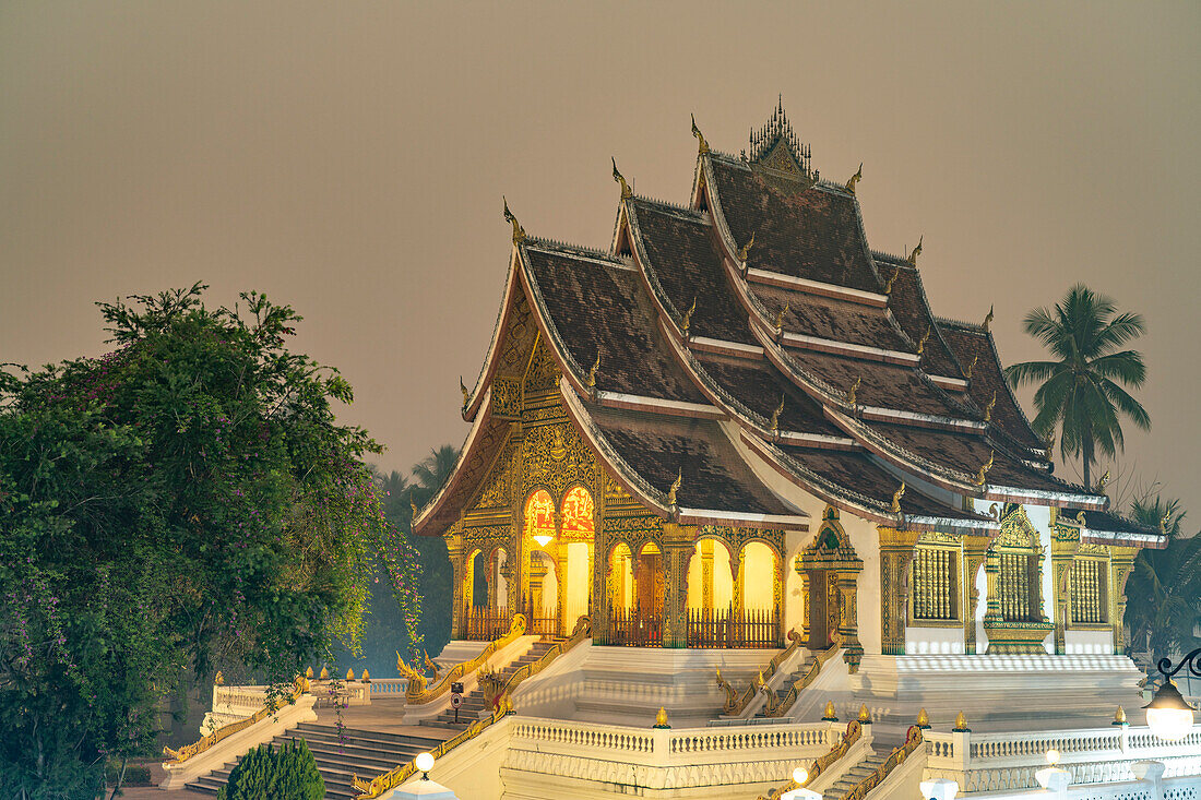 The Buddhist Temple Haw Pha Bang of the Luang Prabang Royal Palace at dusk, Laos, Asia