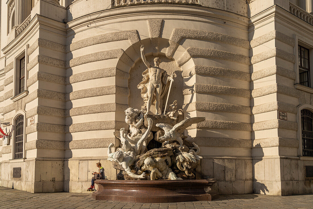 Fountain sculpture Die Macht zu Land, Michaelertrakt of the Hofburg in Vienna, Austria, Europe