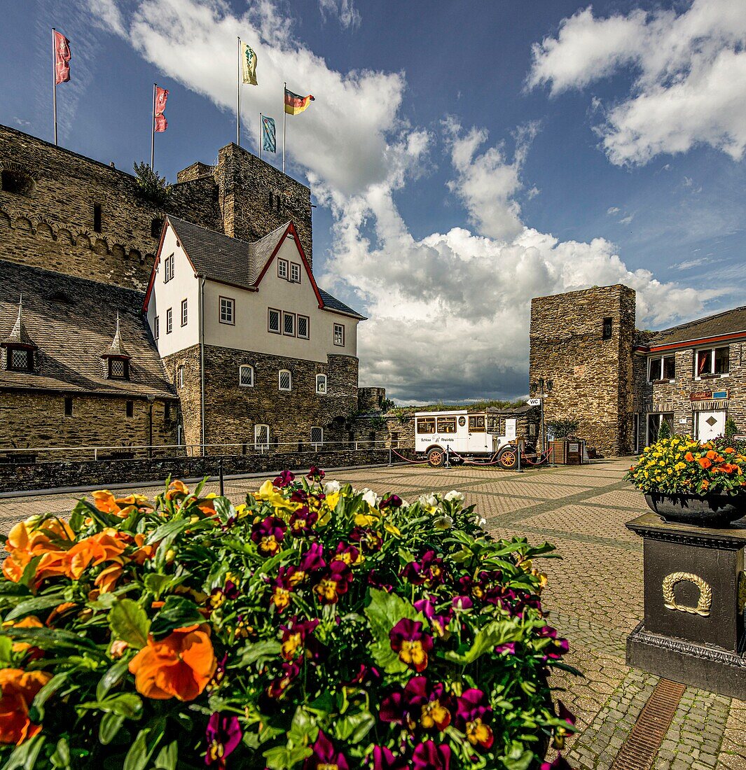 Rheinfels Castle, floral decorations and flags in the entrance area of the castle, St. Goar, Upper Middle Rhine Valley, Rhineland-Palatinate, Germany
