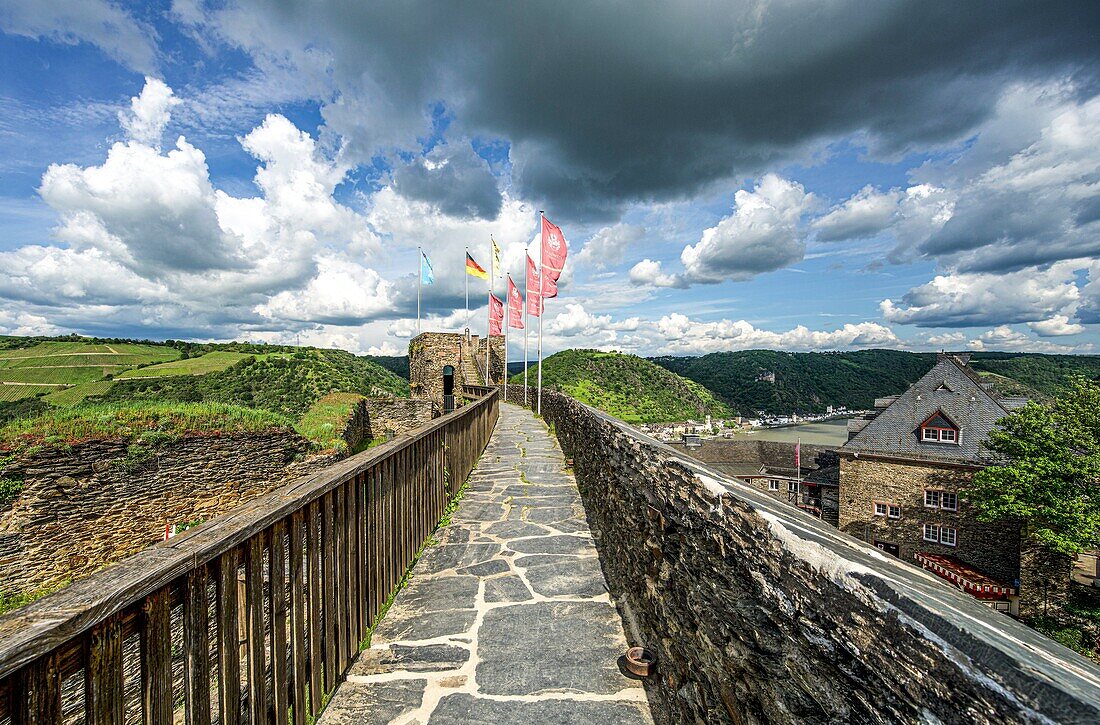 Walkway to the clock tower at Rheinfels Castle, view over vineyards, Hotel Schloss Rheinfels and the Rhine Valley near St. Goarshausen, Upper Middle Rhine Valley, Rhineland-Palatinate, Germany