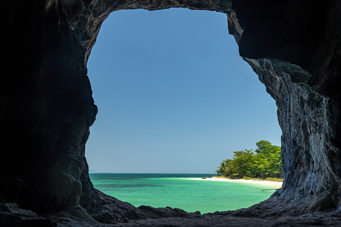 View through the rocks to the beach of Koh Lao Liang island, Thailand, Asia