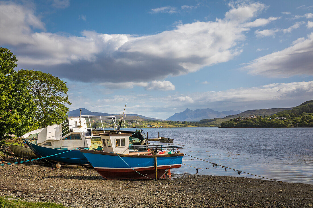Fishing boats on the River Leasgeary Estuary at Portree, Isle of Skye, Highlands, Scotland, UK
