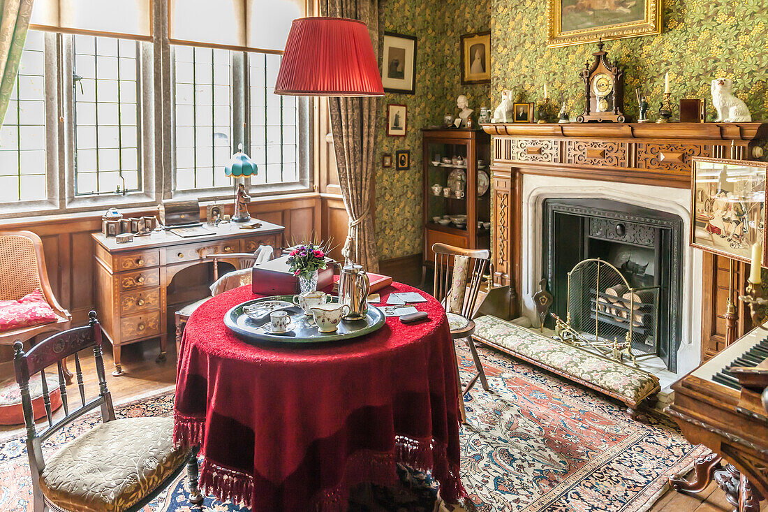 Historic fireplace room at Lanhydrock House near Bodmin, Cornwall, England