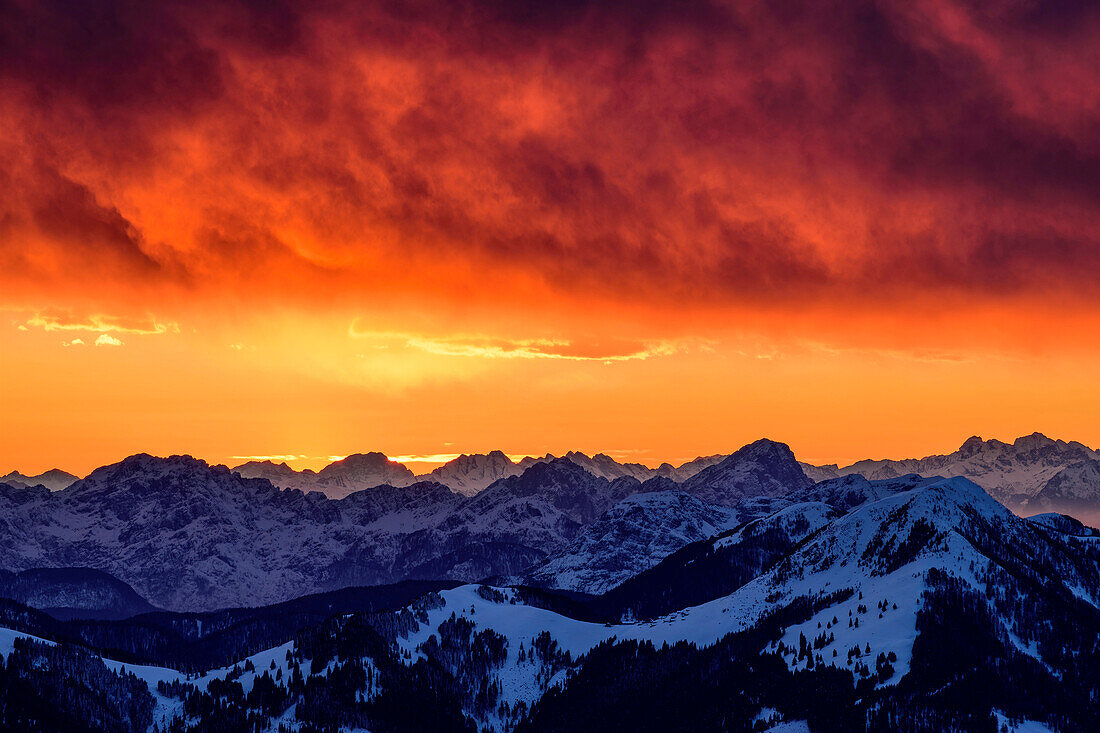 Glowing red clouds after sunset with a view of Col Nudo and Monte Sernio, from Dobratsch, Gailtal Alps, Carinthia, Austria