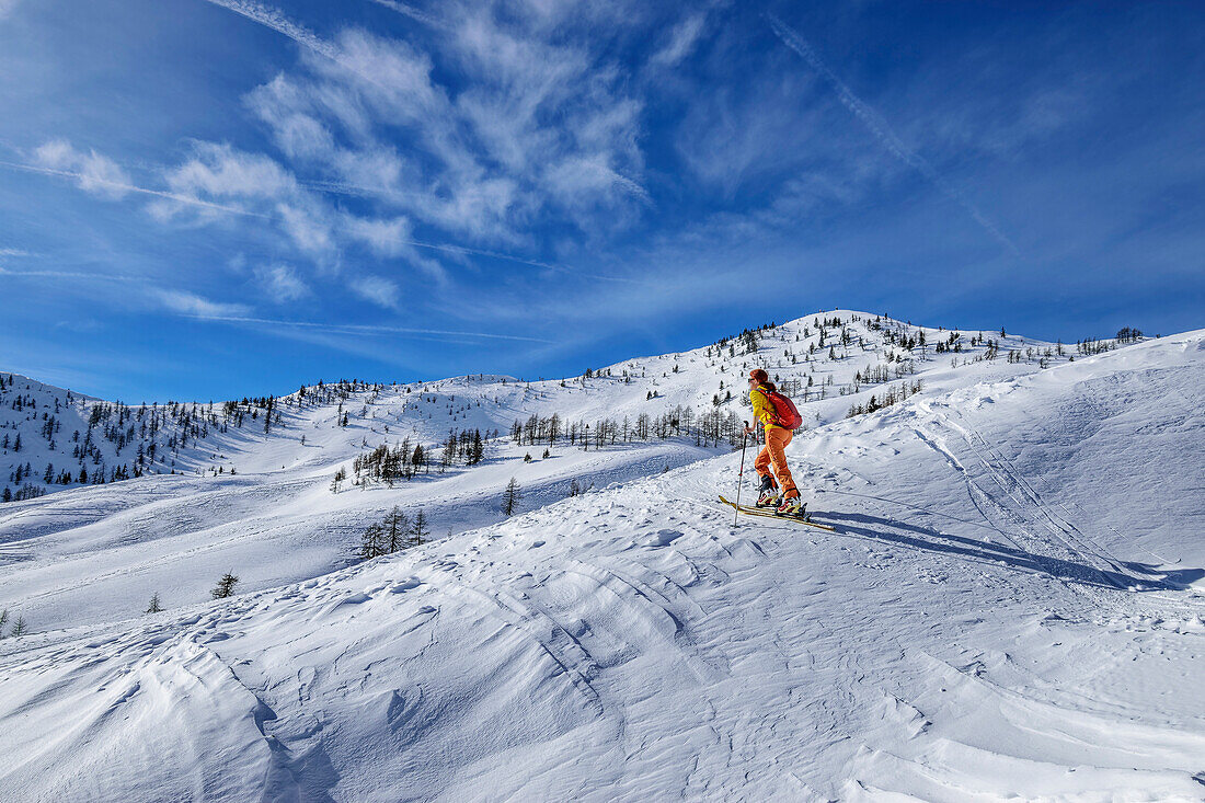 Woman on ski tour ascending to Kleiner Frauenkogel, Kleiner Frauenkogel, Rosental, Karawanken, Carinthia, Austria