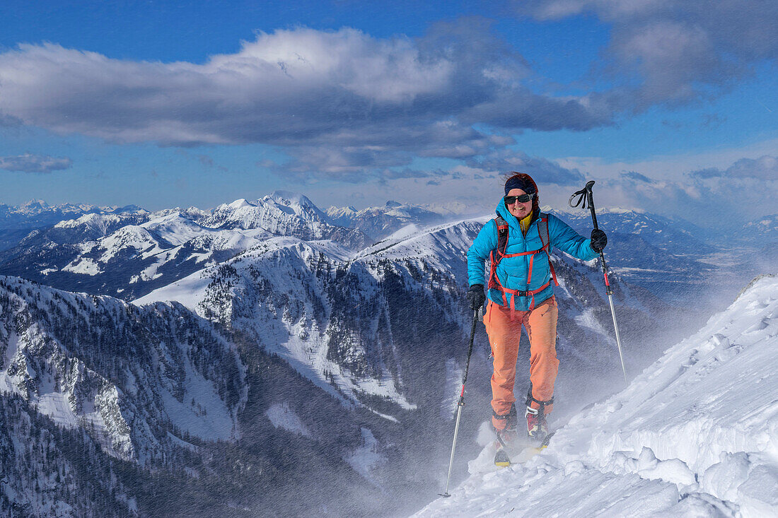 Woman on ski tour ascending to Kosiak through snowstorm, Kosiak, Rosental, Karawanken, Carinthia, Austria