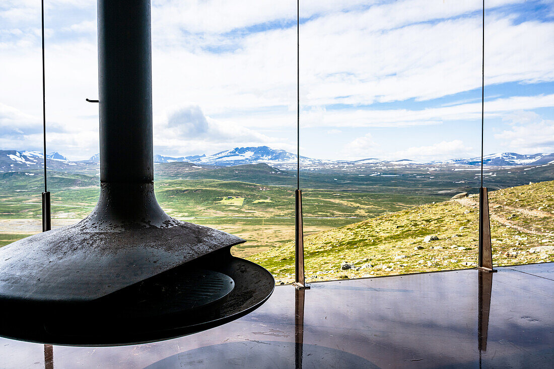 Interior view with fire pit and view at Snoehetta Viewpoint, Hjerkinn, Dovre, Visitor Center wild Reindeer, Dovrefjell-Sunndalsfjella National Park, Tverrfjellhytja, Oppland Region, Norway