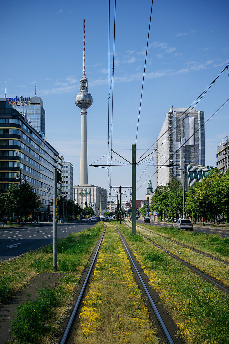 View across train tracks towards the Berlin TV Tower at Alexanderplatz, Berlin, Germany, Europe