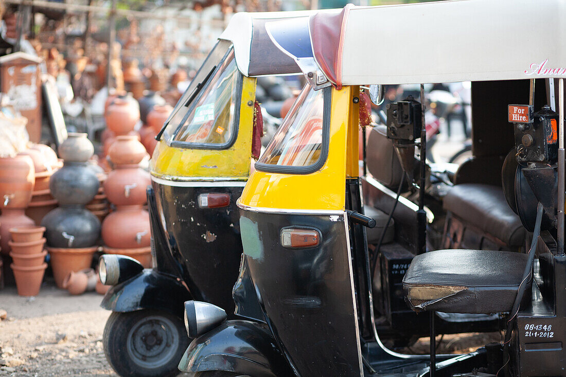 Pune, Maharashtra, India, Rickshaw parked next to clay pot vendors