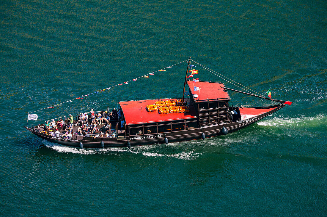 Typical tour boat on the Douro river in the urban area of Porto, Portugal