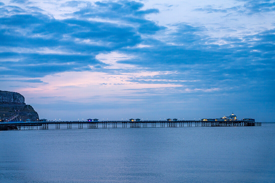 The Victorian Pier in the seaside resort of Llandudno at dusk, Wales, United Kingdom, Europe