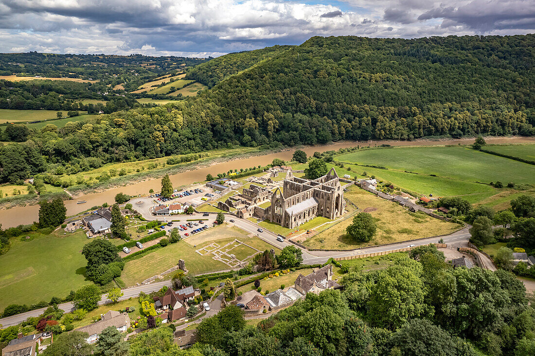 The ruins of Tintern Abbey and the landscape of the Wye Valley seen from the air, Tintern, Monmouth, Wales, United Kingdom, Europe