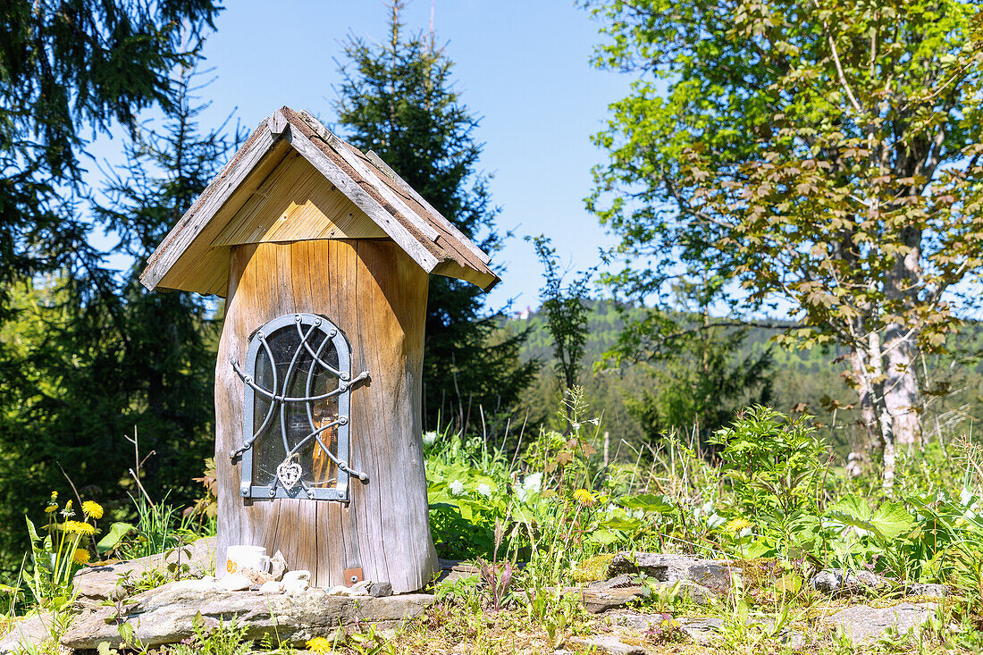 Wayside shrine with St. Francis on the cycle path in the Šumava biosphere reserve near Nový Brunst near Železná Ruda in the Bohemian Forest in the Czech Republic