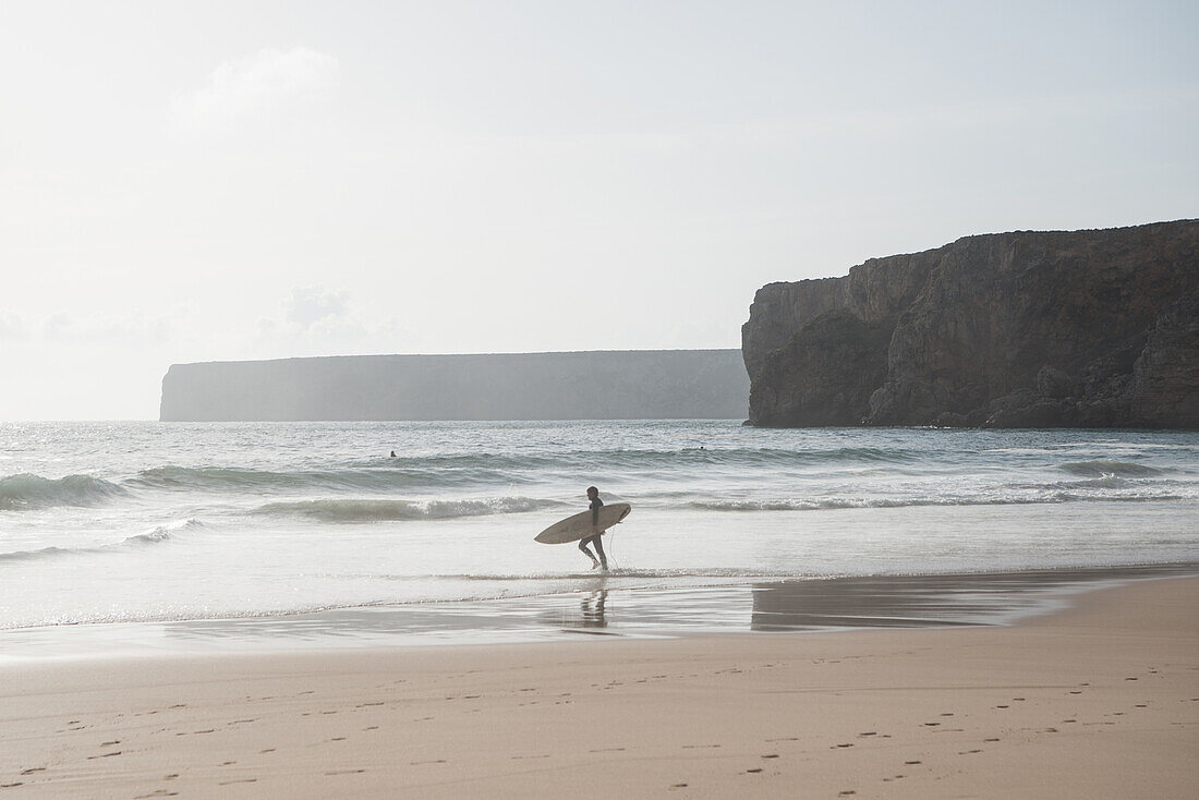 Surfists on the coast, Algarve, Portugal, February 2019