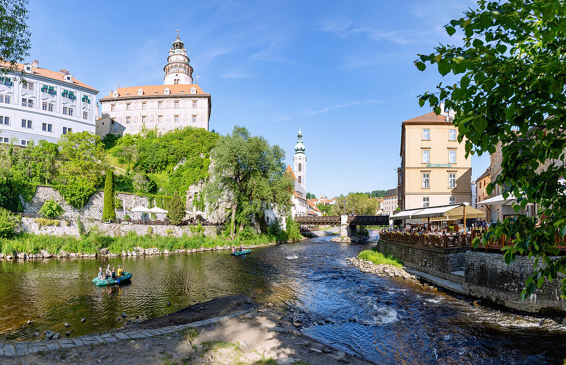 Vltava and Vltava arm with a view of the small castle and castle tower, St. Jobst church and Leylaria restaurant in Český Krumlov in southern Bohemia in the Czech Republic