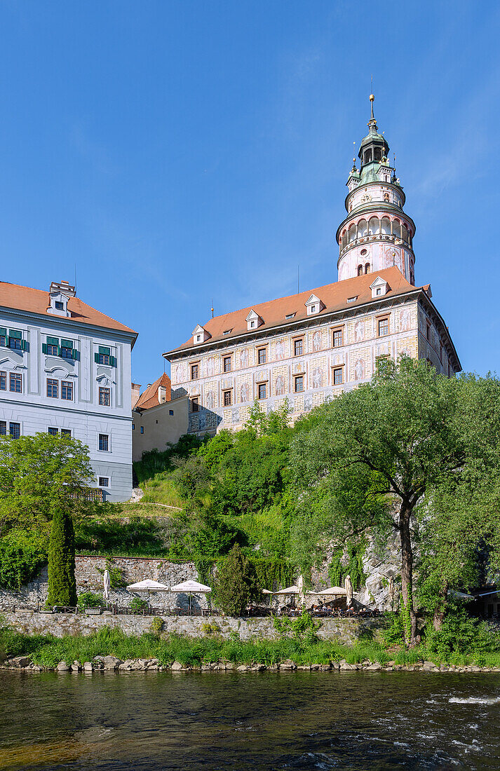 small castle with castle tower over the Vltava in Český Krumlov in southern Bohemia in the Czech Republic