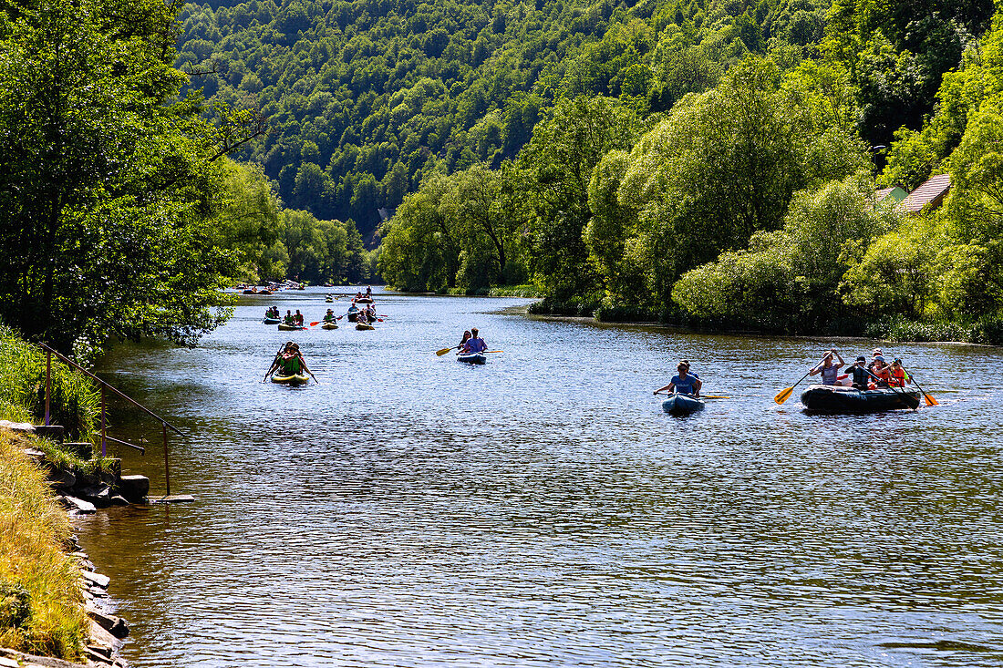Boats, canoes and kayaks on the Vltava River near Plešivec near Český Krumlov in South Bohemia in the Czech Republic